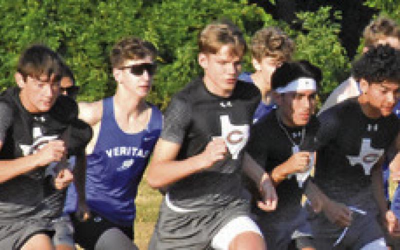 THE HORNET VARSITY cross country team begins running its race at Saturday’s Caldwell XC Invitational. Tribune photo by Roy Sanders