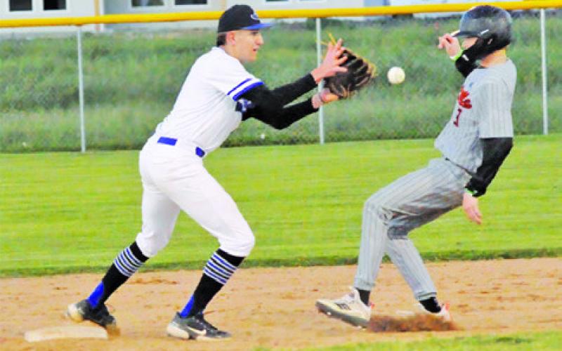 J. BEAUX HRUSKA of Snook gets ready to make the catch and tag Somerville’s Barrett Howe. -- Tribune photo by Denise Squier