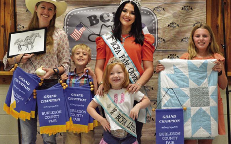 IVY AND RORY CHATWIN won grand in Adult Art, Bloopers, Creative Arts and Crafts, Canned Food and Photography as well as Children’s Corner Art and Horticulture. Emersyn McAllister won grand in Intermediate Quilts. Also pictured are Fair Queen Kodi Hitchcock and Little Miss Taytum Hohlt. Tribune photo by Sabine Lazo