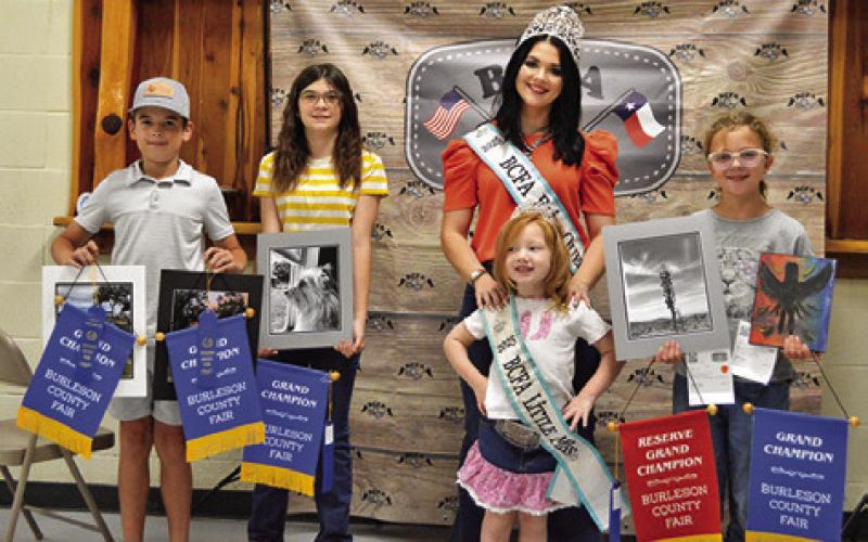 BRAILEY AND CLAYTON DECKER both won grands in Intermediate Photography. Hayden Strong won grand in Junior Art and a reserve in Junior Photography. Also pictured are Fair Queen Kodi Hitchcock and Little Miss Taytum Hohlt. Tribune photo by Sabine Lazo