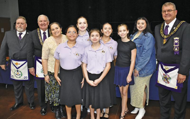 THE RAINBOW GIRLS FROM Westside Assembly in Houston appeared at the 175th anniversary celebration of Caldwell’s Warren Masonic Lodge No. 56. Joining them are, from left, Matt Caldwell, Thomas Griffin and Raborn Reader, Grand Master of the Grand Lodge of Texas.