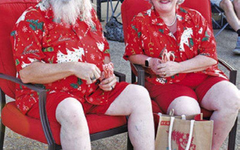 SANTA AND MRS. Claus greet the crowd on Wednesday, July 16, at Christmas in July celebration in downtown Caldwell.