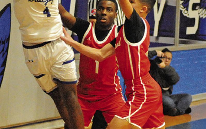 JOHN CARR OF Snook prepares to pass against Bremond. Tribune photo by Roy Sanders