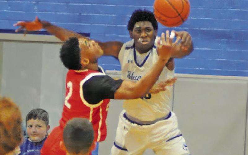 KE’TREEN CARTER of Snook fights for this rebound. Tribune photo by Denise Squier