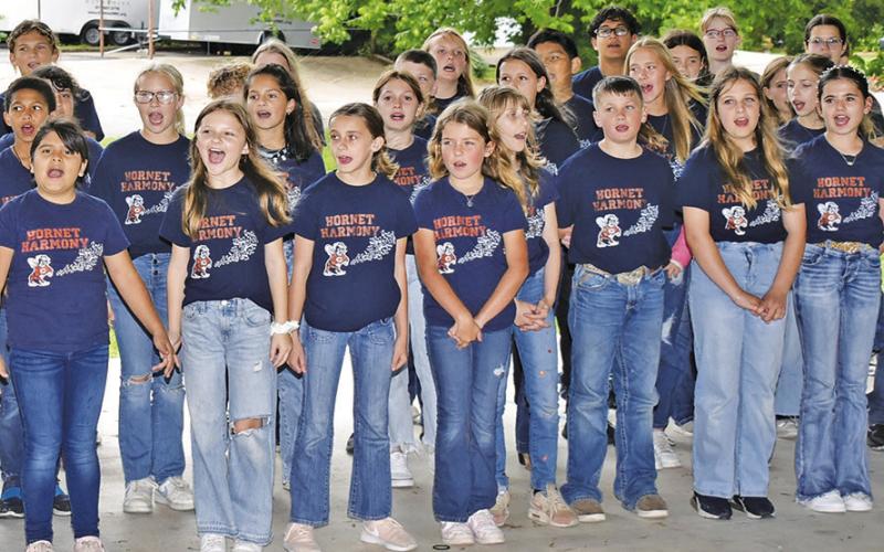 THE CALDWELL INTERMEDIATE School Choir sings with enthusiasm at the National Day of Prayer celebration on May 2 in Caldwell. The choir got strong ovation from the appreciative crowd.