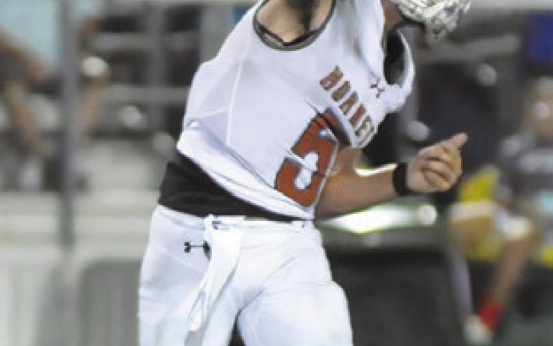 JOHN FRYREAR passes the ball against Robinson. Tribune photo by Denise Squier