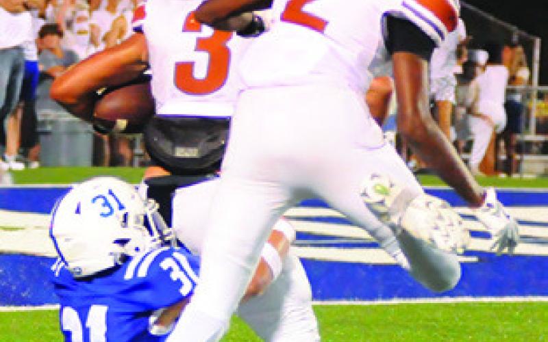 COY BECKA runs for the endzone with teammate Jaden Hagan behind him. Photo by Denise Squier