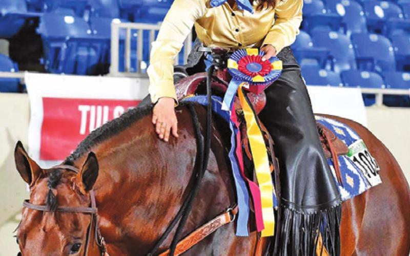SABINE LAZO CELEBRATES with Hes Styled (“Stylz”) after winning the Open Western Dressage, Intro Level Test 3 title at the 2022 Pinto World Championship Show in Tulsa, Oklahoma, last week. -- Photo courtesy of Jeff Kirkbride Photography and PtHA