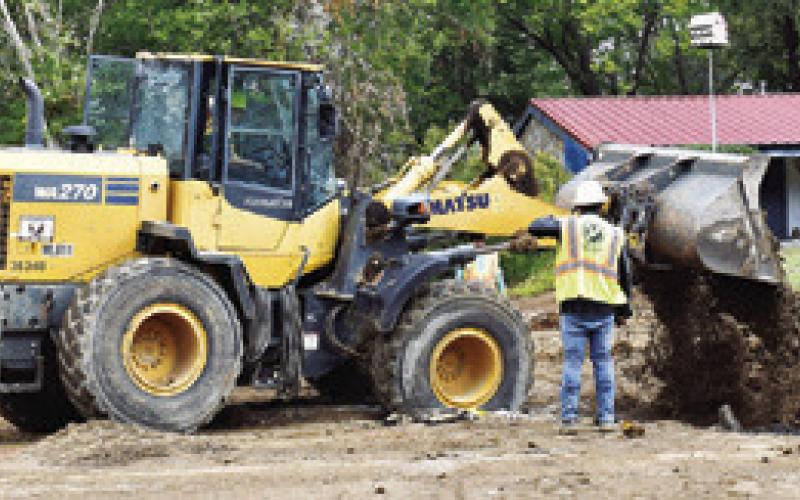 LARRY YOUNG PAVING of Bryan works on this drainage project on Harvey Street last Friday in Caldwell. Tribune photo by Roy Sanders