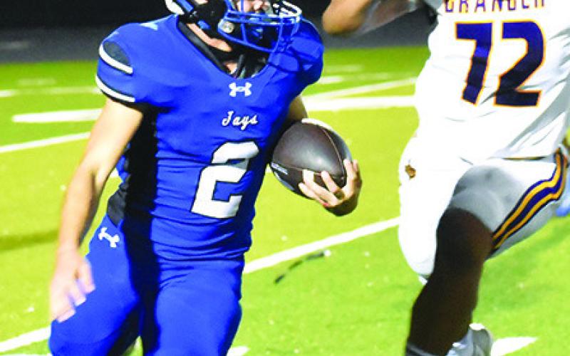TRISTAN YEN of Snook carries the ball in the Bluejays game against Granger. Tribune photo by Roy Sanders