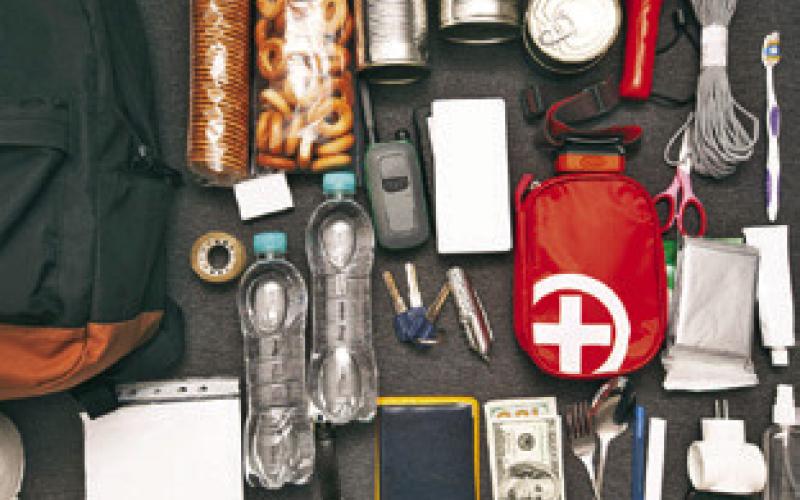 A GO BAG that includes water, first-aid supplies, flashlight and other items can help families be prepared when severe weather such as hurricanes pose a threat. Adobe stock image