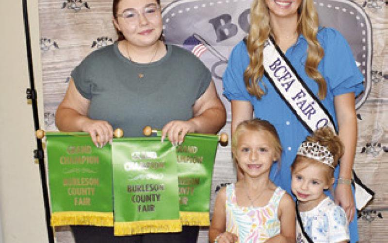 TRUDIE KOVAR WON grand champion for Children’s Corner recycle, and Audrey Schmidt for photography. Joining them are Fair Queen Hadleigh Novosad and Little Miss Avery Grace Freeman.