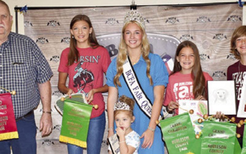 KEITH KOLOJACO WON grand champion for a wood projects and is joined by other grand champions, Hannah Marshall, Joshua Marshall and Evelyn Marshall. Joining them are Burleson County Fair Queen Hadleigh Novosad and Little Miss Avery Grace Freeman.