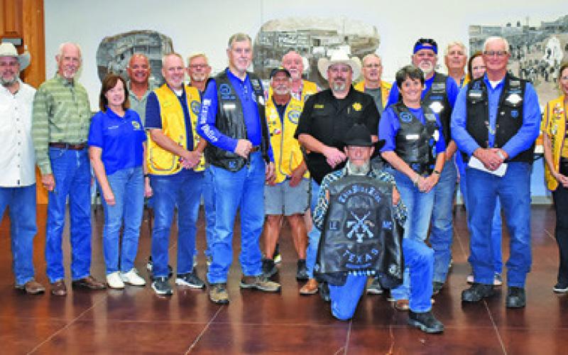 LIONS CLUB MEMBERS GATHER on Monday with members of Brazos Valley Thin Blue Line.