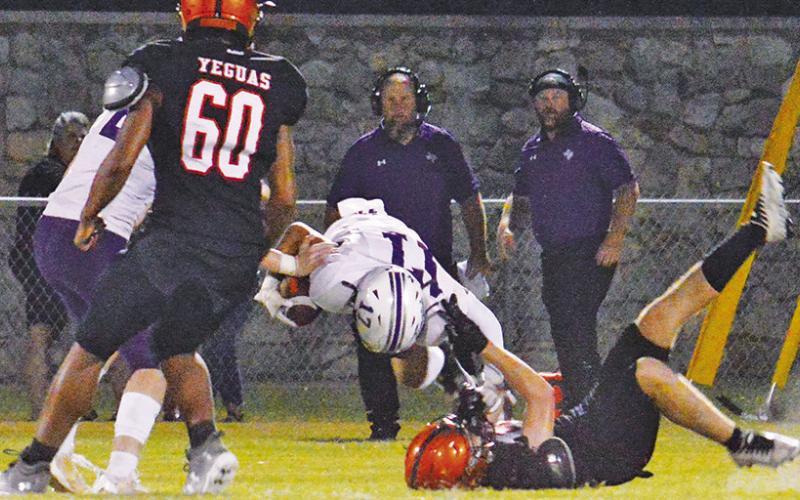 SOMERVILLE’S DEFENSE stops this Thrall ball carrier in last Friday’s game. -- Tribune photo by Kim Hutcheson