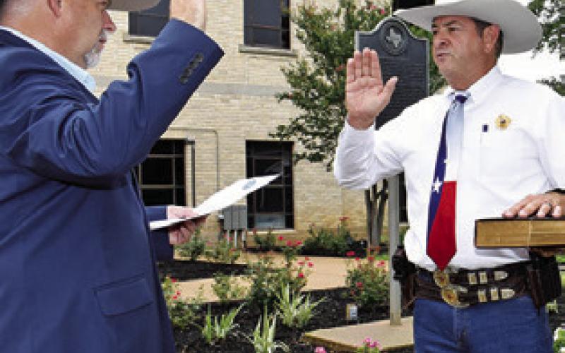 BILL RIOS is sworn in as Burleson County Sheriff by County Judge Keith Schroeder on Tuesday, June 10, at the courthouse.