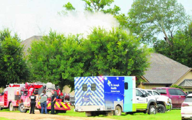 FIREFIGHTERS FROM CALDWELL and Deanville respond to this house fire on Thursday, July 18, on County Road 100.