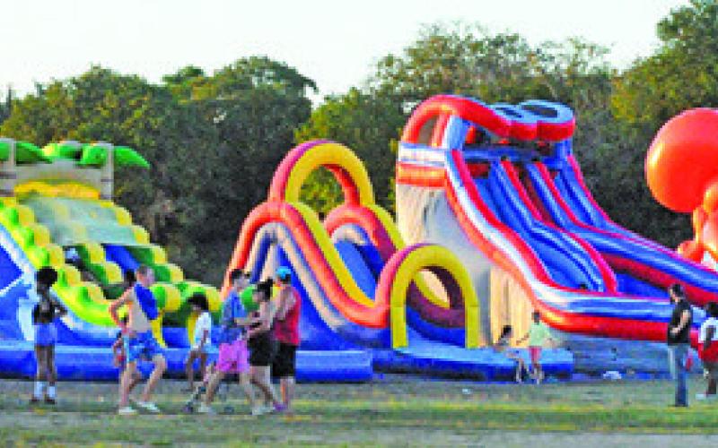 DIFFERENT WATER SLIDES were out at Welch Park on July 4. Tribune photo courtesy of Denise Squier