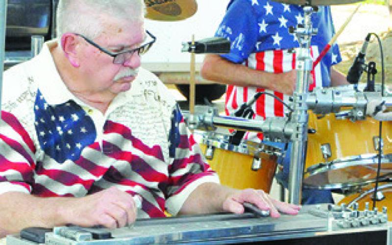 A STEEL GUITAR was a featured instrument in the Jamie Jennings Band at the Elizabeth Lutheran Church’s July 3rd Celebration. Tribune photo courtesy of Denise Squier