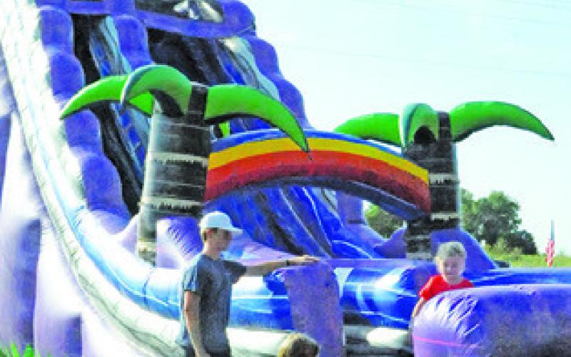 BOUNCE HOUSES and slides were fun for area children during the Elizabeth Lutheran Church’s July 3rd Celebration. Tribune photo courtesy of Denise Squier