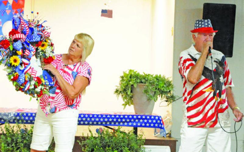 THE ANNUAL HERMANN SONS Life-Deanville’s July 4 celebration included a live auction with many patriotic items. Tribune photo courtesy of Denise Squier