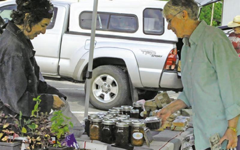 COUNTY RESIDENTS love to shop Saturday mornings at the weekly Farmer’s Market in downtown Caldwell. Tribune photo by Denise Squier