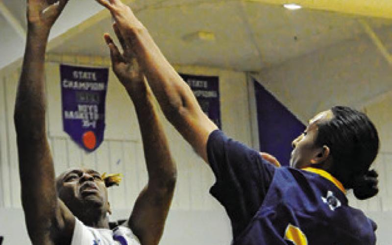 JEREMIAH POWELL of Snook shoots against Allen Academy. The Bluejays won 78-19. Tribune photo by Denise Squier
