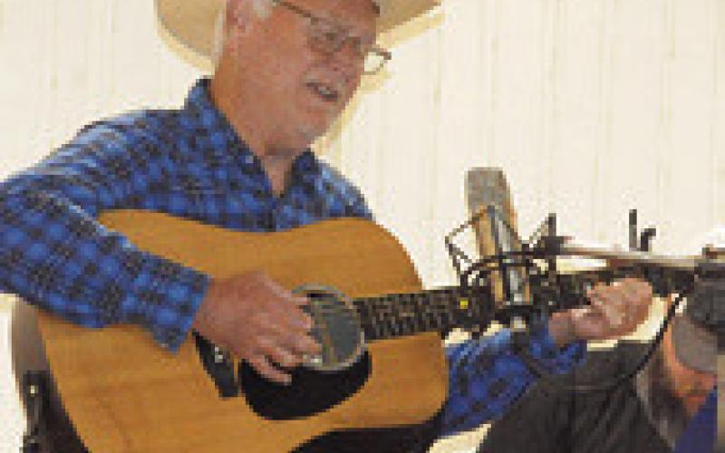 ROY SANDERS, a Texas Folklore Society musician, joined fellow society musician Lee Haile in playing historic cowboy music and rural American folk music at the Chisholm Trail Heritage Festival in Deanville.
