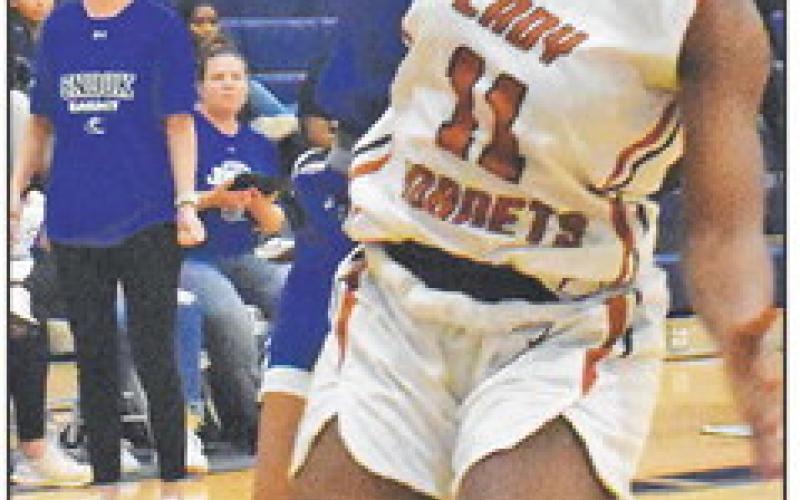 ALANA STRINGFELLOW is fouled by Amoree Densond during the Snook-Caldwell game last Friday.