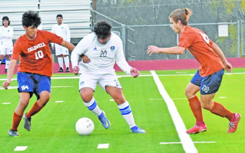 CALDWELL PLAYERS DEFEND as the Hornets defeat Jarrell 6-0 in their season opener.