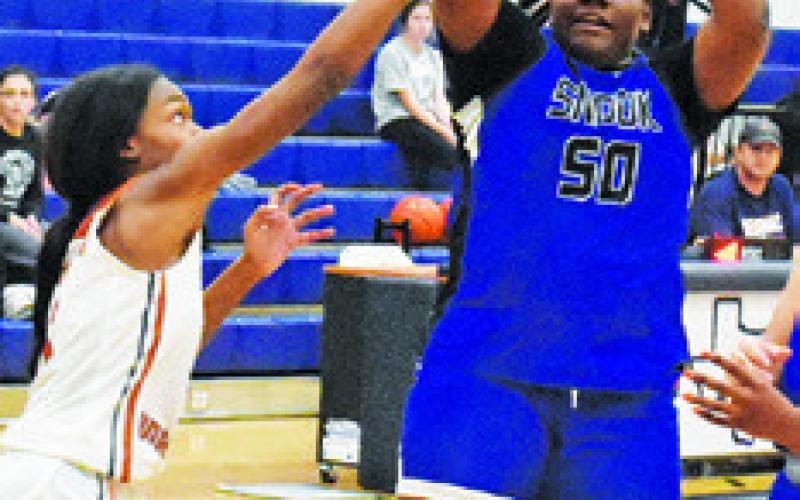 MYKIA MUNSON shoots the ball during the Snook-Caldwell game last Friday in Caldwell.
