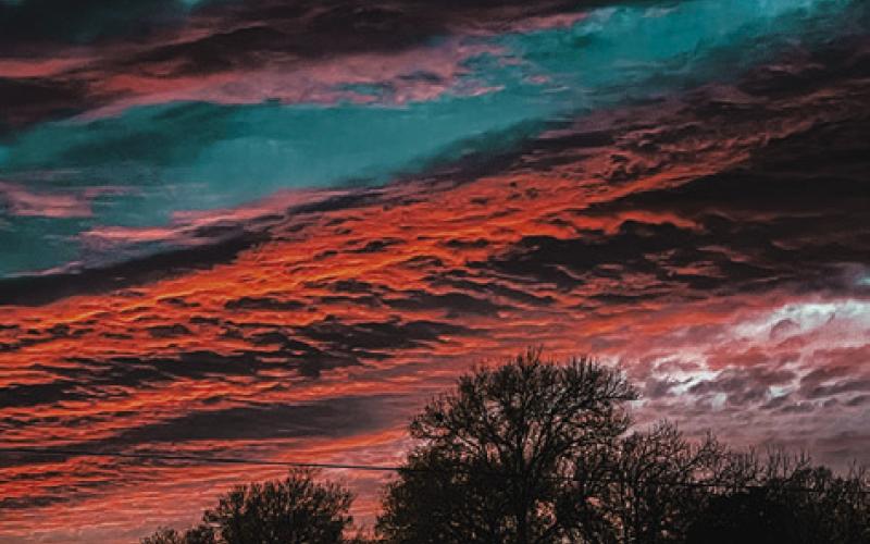 THIS BEAUTIFUL COLORFUL SKY WAS visible last Thursday, Jan. 30, during sunset over Burleson County. Tribune photo by Denise Squier