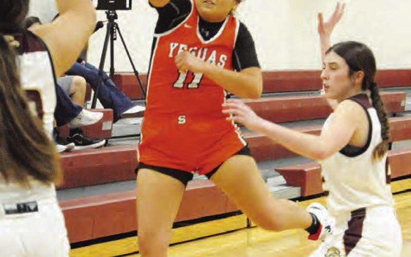 SOMERVILLE’S VIVIANNA MUNOZ passes the ball to a teammate during the Lady Yeguas’ road loss to Milano last Friday night.