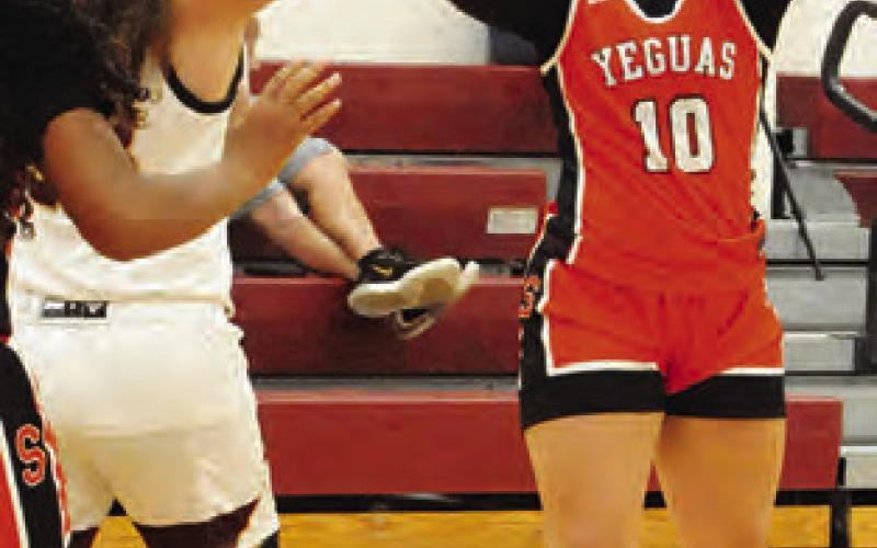 BRYANNA SUROVIK shoots the ball during the Somerville-Milano game last Friday night.