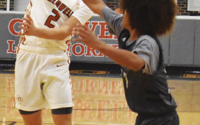 NATHAN HERMES passes the ball against Bryan JV in the round one game of the Kolache Capital Tournament in Caldwell. Tribune photo by Roy Sanders