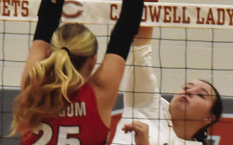 KIERSTYN MACIK goes one-on-one with a BVCHEA Homeschool blocker during Caldwell’s win Friday night. Tribune photo by Roy Sanders