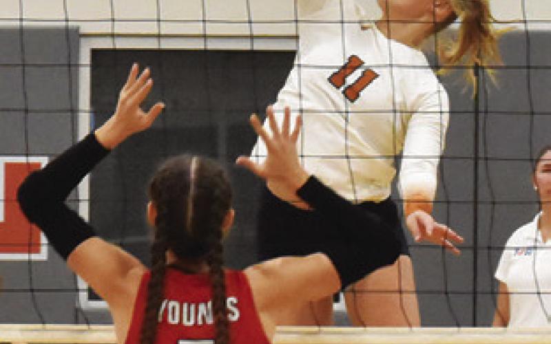 REESE MCMANUS prepares to attempt a kill during Caldwell’s win Friday night. Tribune photo by Roy Sanders
