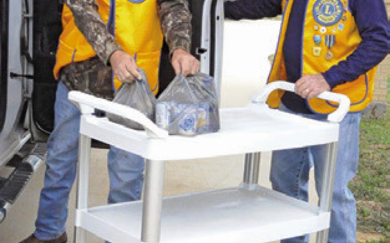 LAKE SOMERVILLE LIONS CLUB was among the many local groups to send volunteers for this year’s Food for Families food drive. Tribune photo by Denise Squier