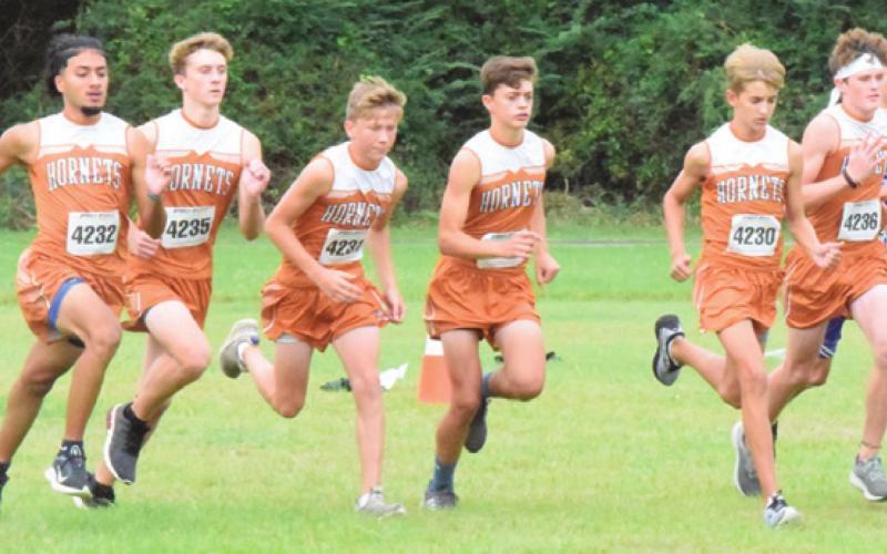 THE CALDWELL BOYS’ VARSITY cross country team starts their race last week at the District 19-3A Cross Country Meet at Davidson Creek Park. -- Tribune photo by Denise Squier