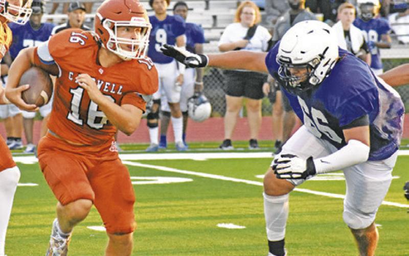 KEIFER ELLIS OF Caldwell carries the ball against Navasota in the Aug. 18 scrimmage. -- Tribune photo by Roy Sanders