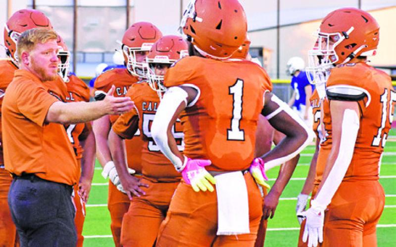 CALDWELL HEAD COACH Boone Patterson talks to the team during the Aug. 18 scrimmage with Navasota. -- Tribune photo by Roy Sanders
