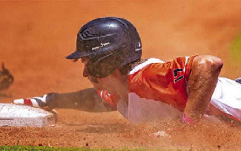 DANIEL BARDIN slides into a base during the recent Homeschool World Series.