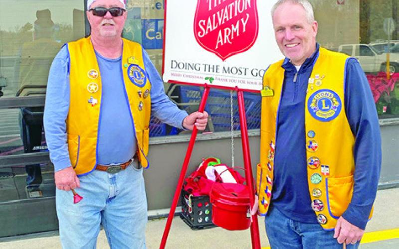 LIONS CLUB MEMBERS had a fun day recently ringing the Salvation Army Bell. Various members manned the kettle from 9 a.m. to 4:30 p.m. Pictured, from left, are Danny Jones and Kavon Novak.