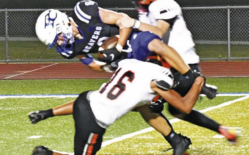 SOMERVILLE DEFENDERS, including Gardner Shivers, front, make a tackle against Falls City. -- Photo by Marian Laskowski