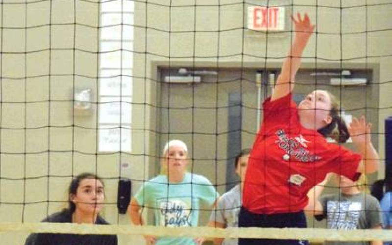 BUMP, SET, SPIKE DRILLS were a part of a volleyball clinic in Snook. Olympic gold medalist and World Champion volleyball player Patrick Powers hosted the clinic. -- Tribune photo by Denise Hornaday