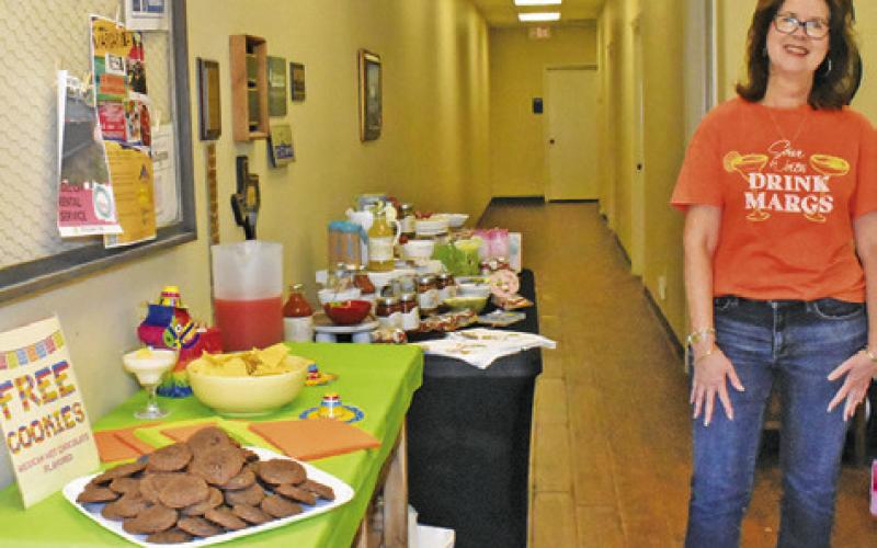 TRACY PIEPER DISPLAYS these refreshments on Saturday, May 2, at the Margarita Fest in downtown Caldwell.