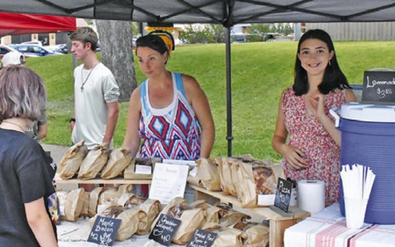 VENDORS LINED THE streets on Saturday, July 13, during the Main Street concert and street dance. -- Tribune photo by Roy Sanders