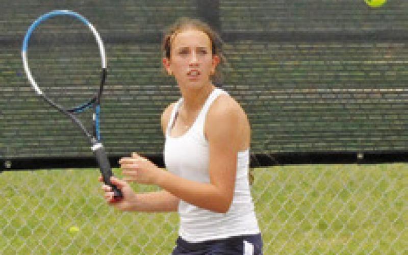 KYLIE VOGLER prepares to return serve during a mixed doubles match at the Class 4A Region 3 Tennis Tournament at Rudder High School. -- Tribune photo by Denise Squier