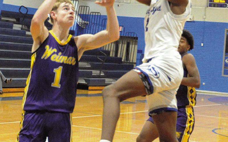 JIMMY KEARNEY OF Snook takes a shot against Weimar. The Bluejays won 52-35 to improve to 14-2 overall. Tribune photo by Denise Squier
