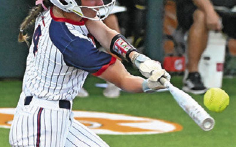 GRACE STROBEL makes contact with the ball for a foul ball during the Wimberley-Liberty state semifinal softball game in Caldwell. Tribune photo by Denise Squier